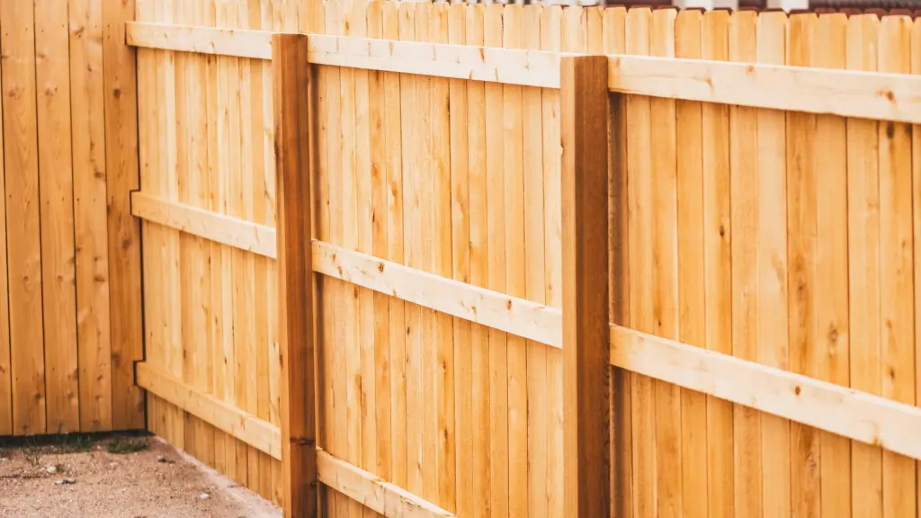 Close-up of a cedar wood privacy fence with dog-ear pickets