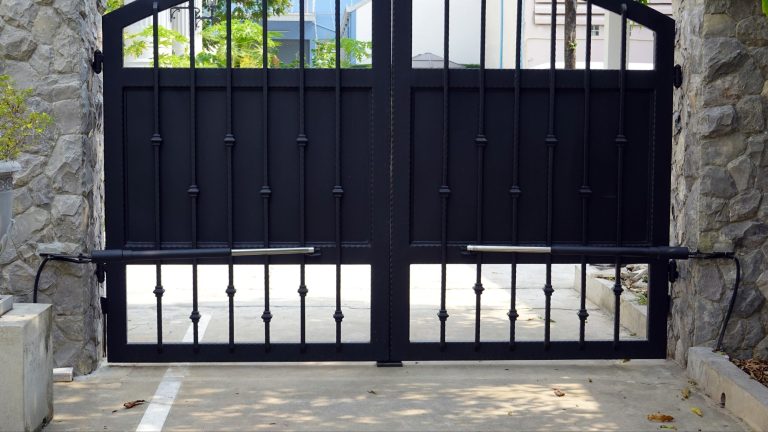 Black iron double swing driveway gate with automatic openers